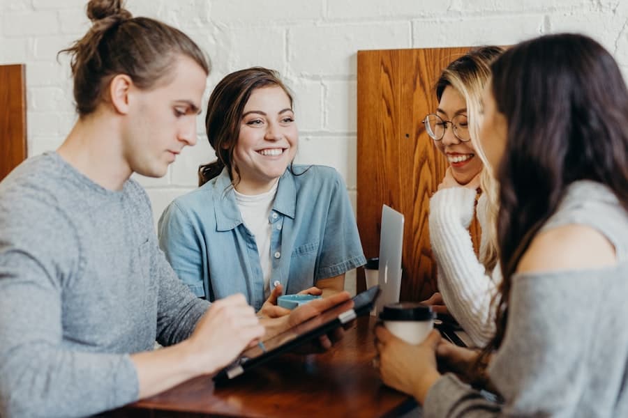 Friends having a relaxed conversation around a table