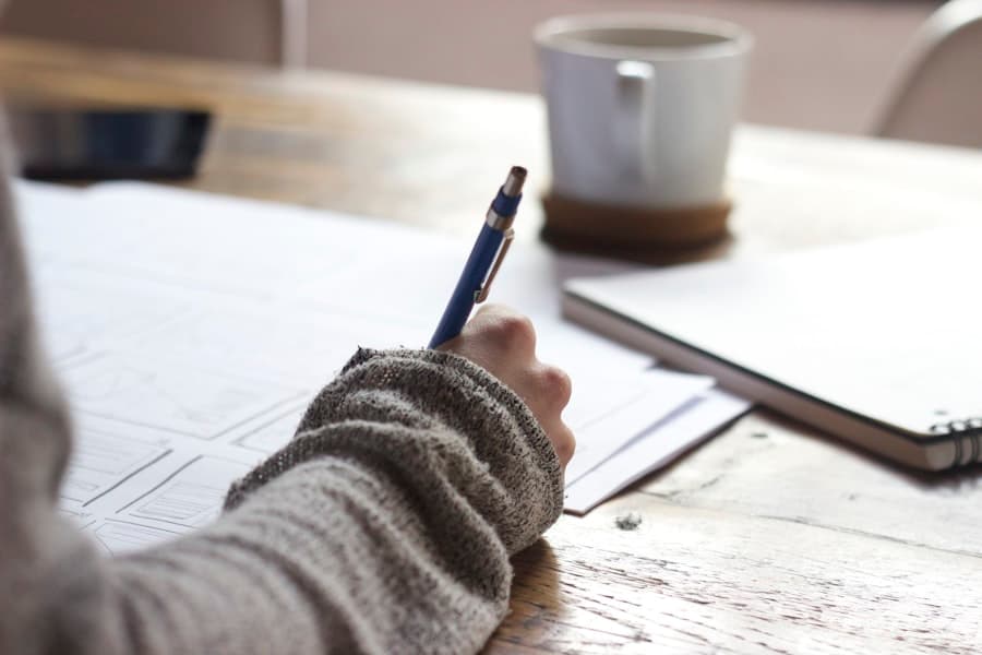 A learner practicing writing in a notebook